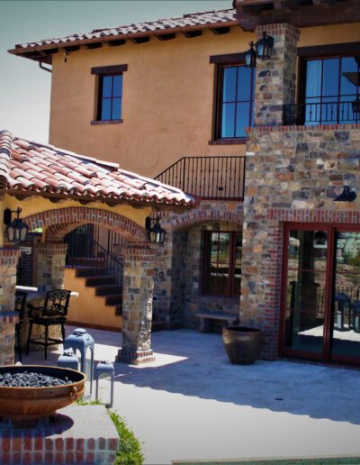 A patio with a fire pit.