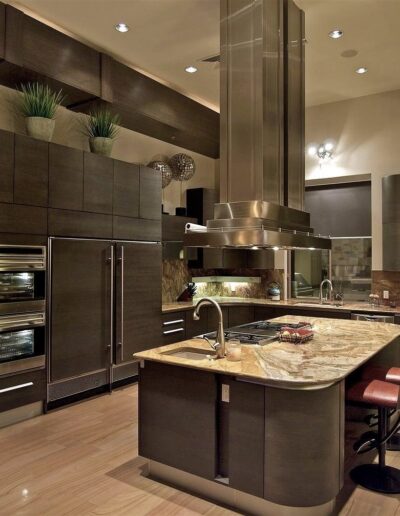 A modern kitchen with brown cabinets and a center island.