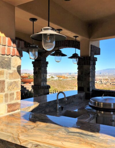 An outdoor kitchen with a view of the mountains.